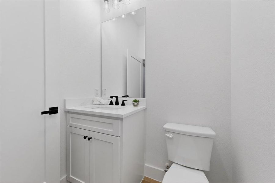 Bathroom featuring vanity and toilet