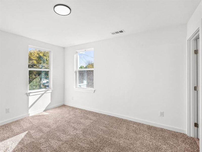 Unfurnished room with baseboards and carpet flooring