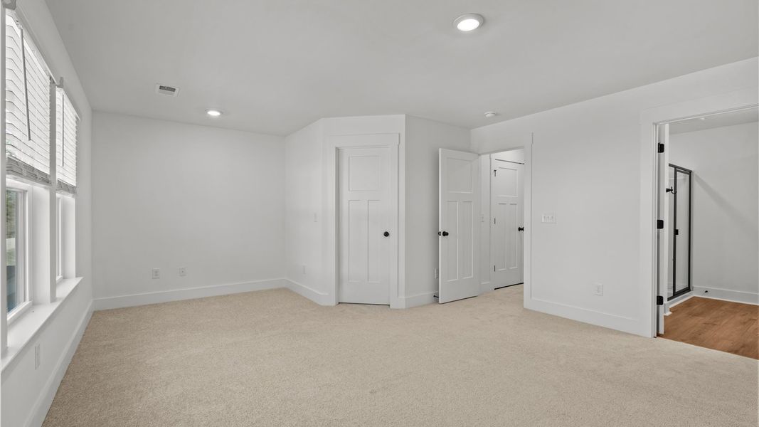 Primary suite that offers first-rate relaxation with established style and elevated finishes