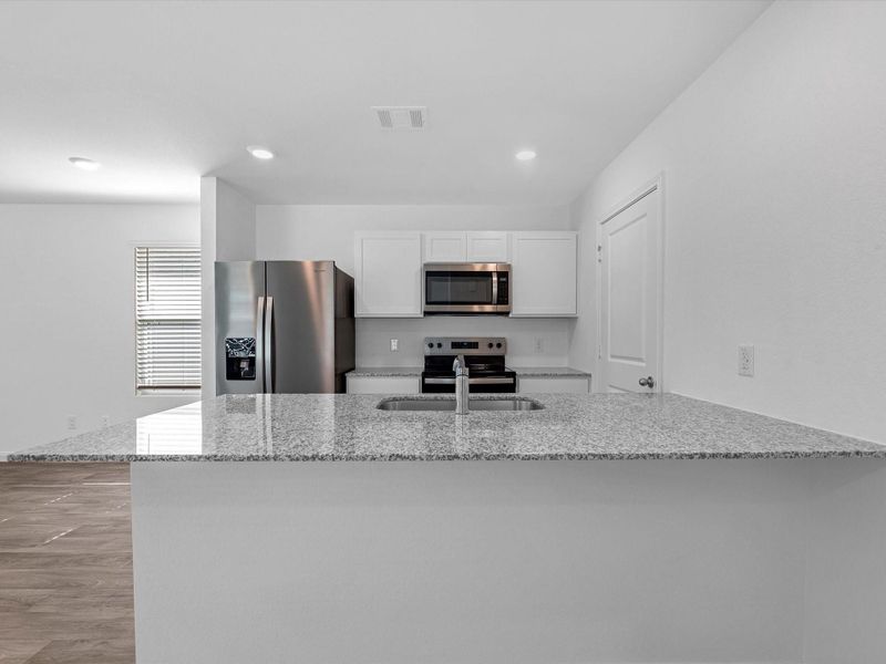 Furnished interior view inside a new home in William Trails, Willis (Image 8).