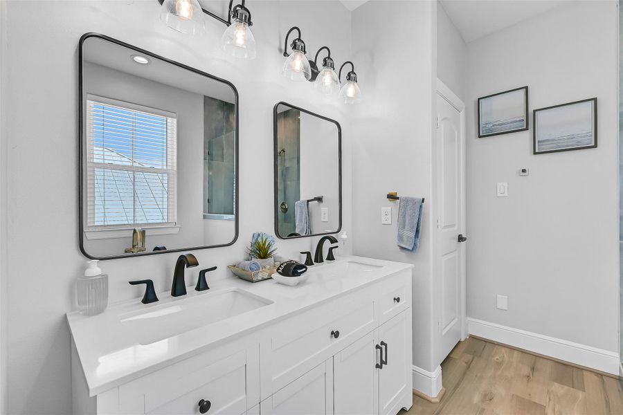 Custom tile details add texture and personality to the shower while giving the bath a polished designer feel.