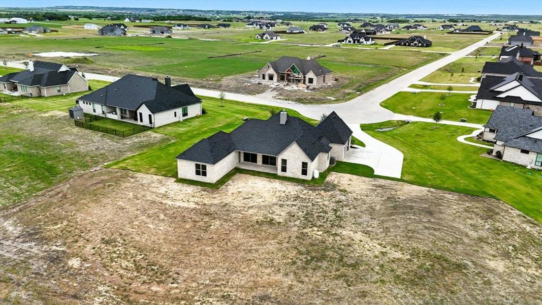 Front exterior of a new home in , Venus, TX, highlighting curb appeal (Image 27). Front exterior of a new home in , Venus, TX, highlighting curb appeal (Image 27).