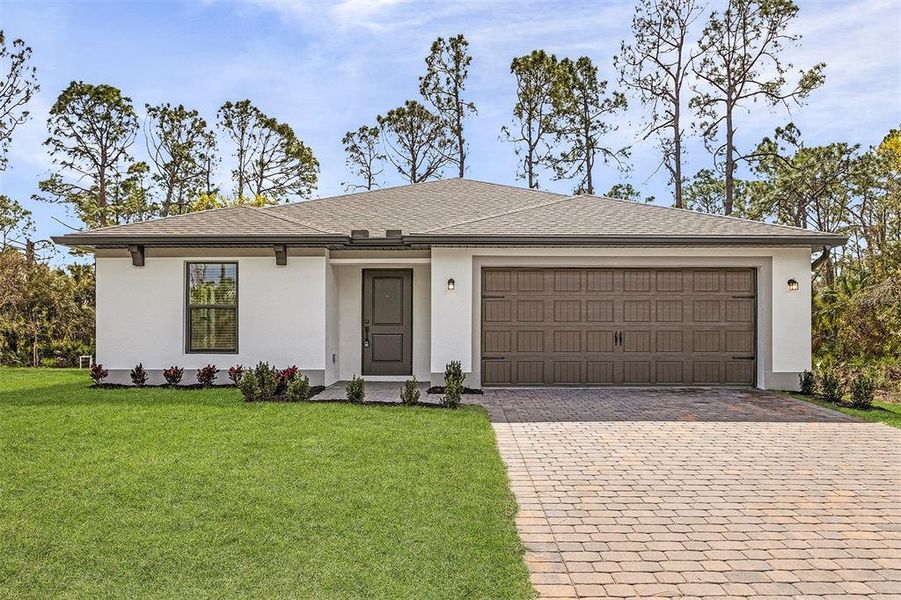 Front exterior of a new home in Port Charlotte, North Port, FL, highlighting curb appeal (Image 1).