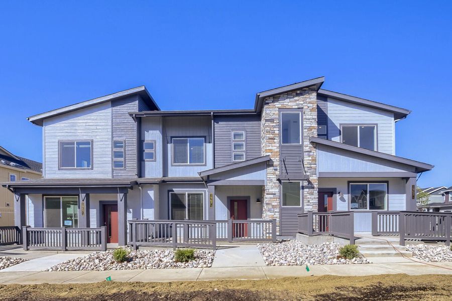 Front exterior of a new home in Timber Lark, Fort Collins, CO, highlighting curb appeal (Image 1). Front exterior of a new home in Timber Lark, Fort Collins, CO, highlighting curb appeal (Image 1).