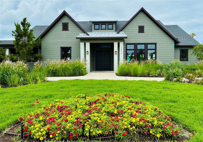Front exterior of a new home in Two Rivers, Zephyrhills, FL, highlighting curb appeal (Image 17).
