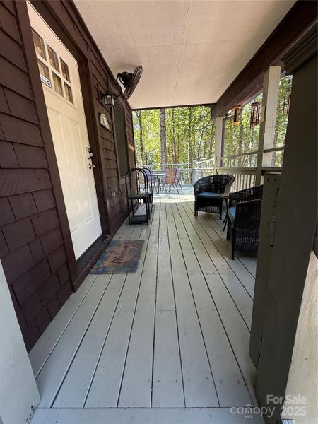 Covered Patio with Entry on Main level from stairs
