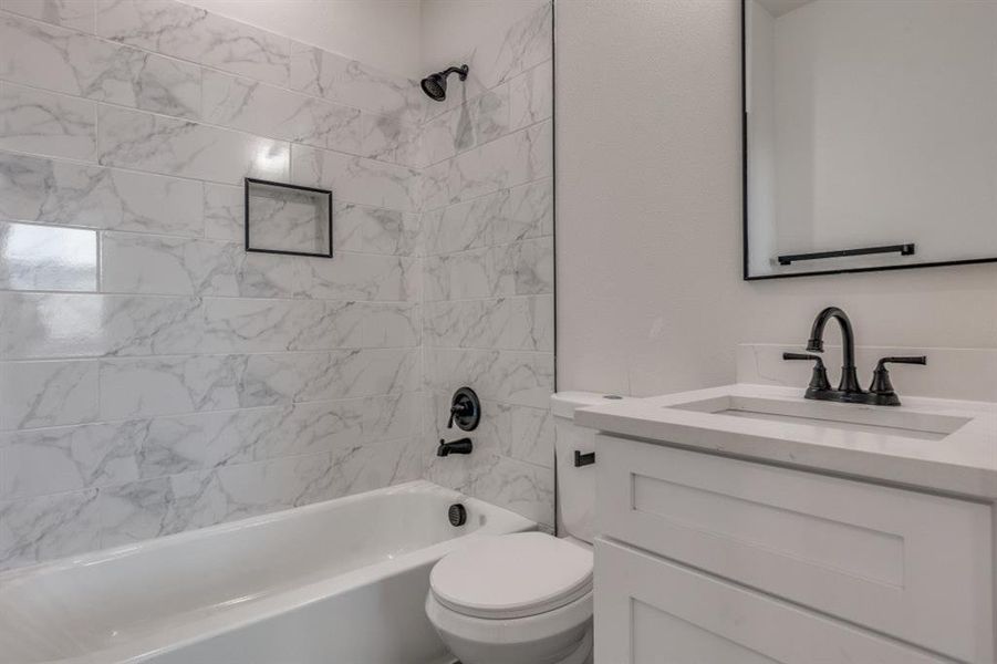 Full bathroom with bathtub / shower combination and vanity Full bathroom with bathtub / shower combination and vanity