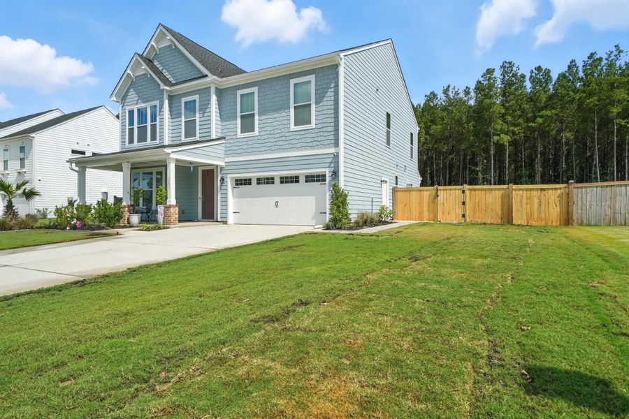 Front exterior of a new home in , Ravenel, SC, highlighting curb appeal (Image 2).