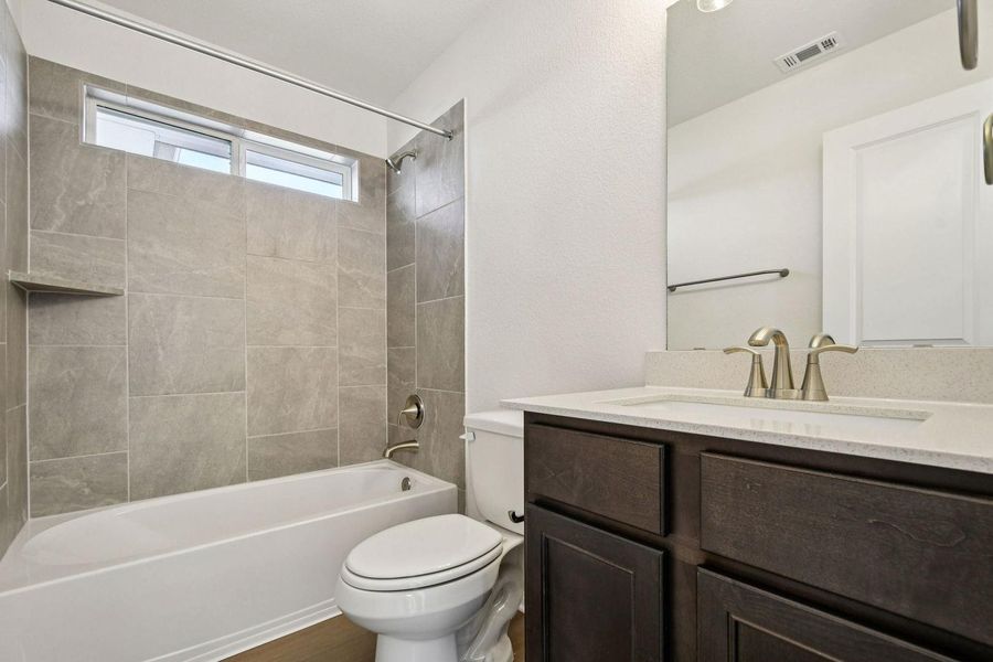Bathroom with tub / shower combination and vanity