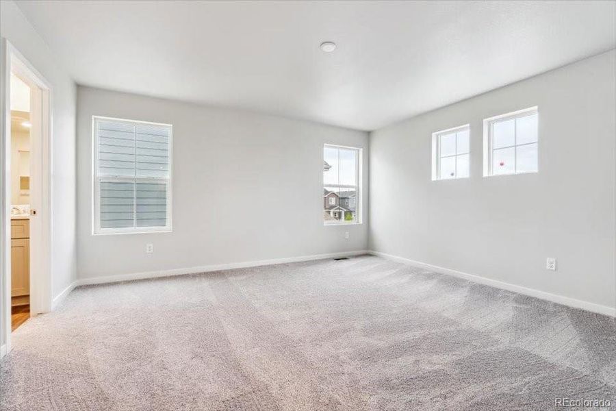 Spacious, unfurnished interior of a new home in The Haven II Collection  at Painted Prairie, Aurora (Image 14).