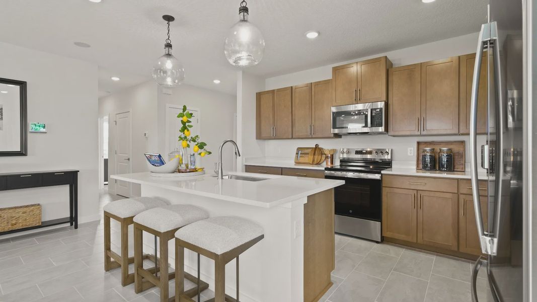 Castaway Kitchen and Dining Area, new home plan available at Liberty Trace in Haines City, fl