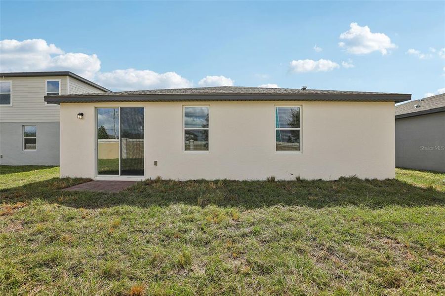 Exterior details and patio area of a home in Lawson Dunes - Signature Series, Haines City (Image 25).