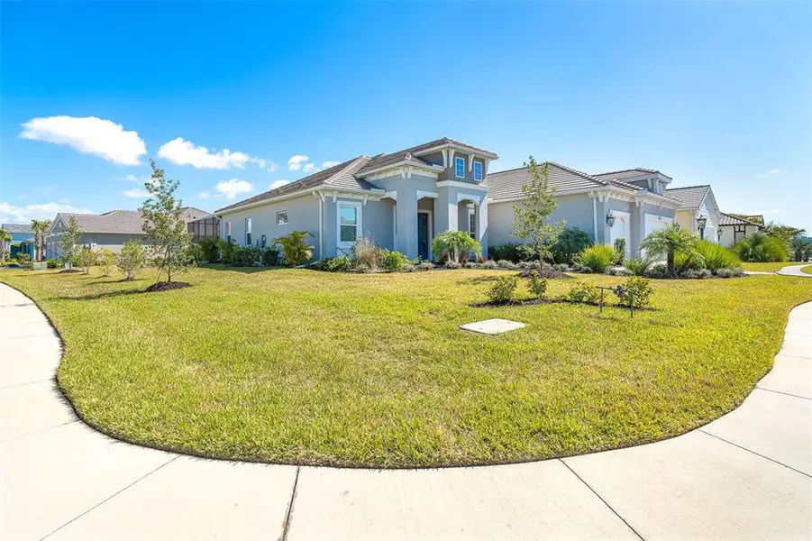 Front exterior of a new home in , Englewood, FL, highlighting curb appeal (Image 2).