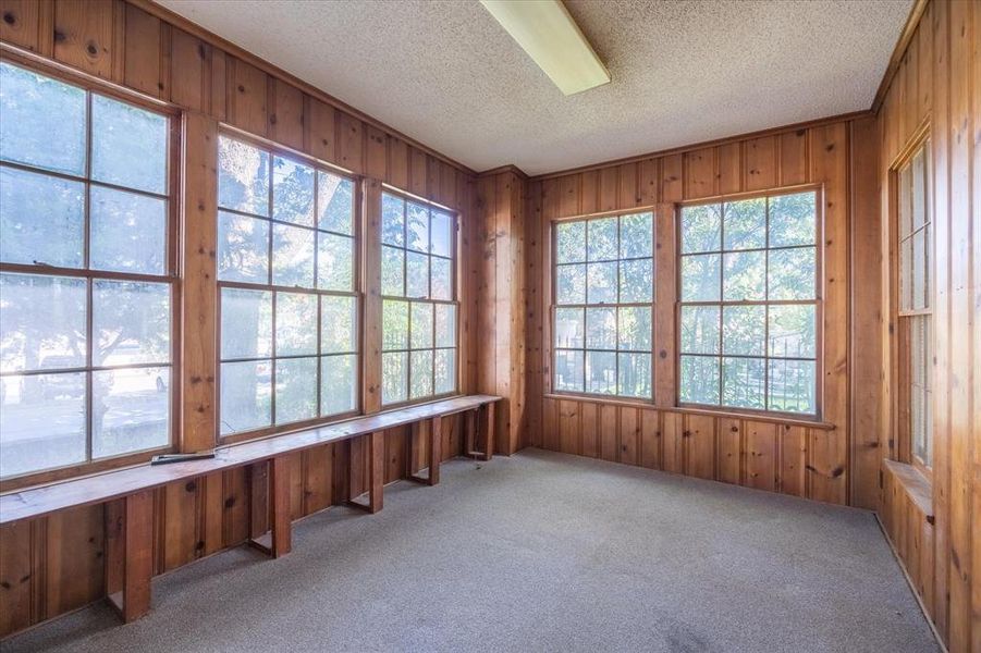 Unfurnished sunroom with a healthy amount of sunlight