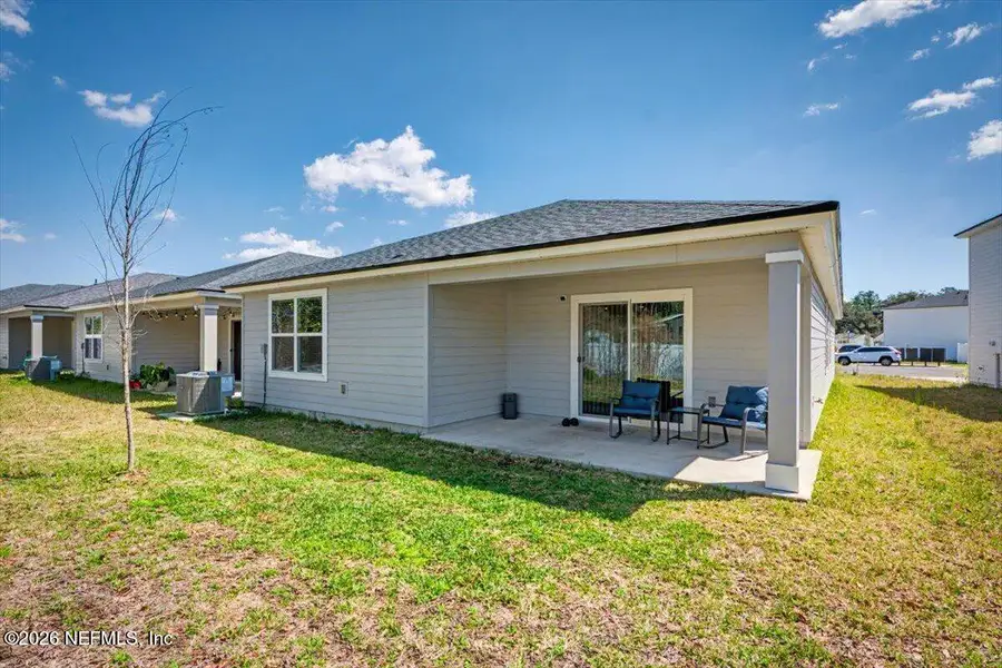 Exterior details and patio area of a home in Kings Landing, Jacksonville (Image 4).