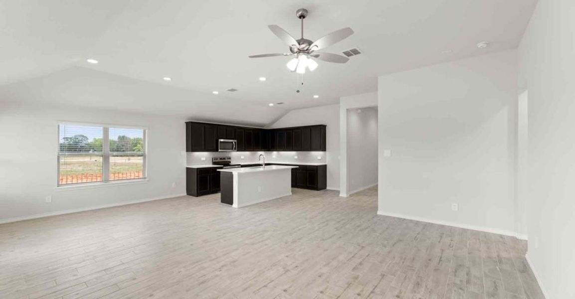 Representative exterior photo of a completed home built from the Atlanta by Impression Homes in Keeneland, Aubrey, TX (Image 11).