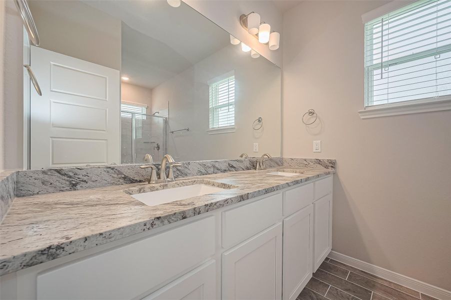 Furnished interior view inside a new home in Sunterra, Katy (Image 18).