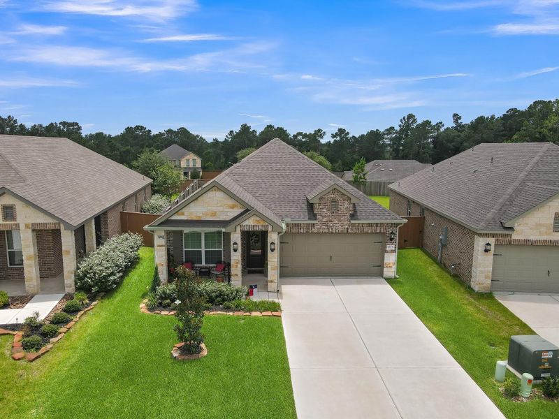 Beautiful curb appeal with a striking brick-and-stone elevation, covered front porch, manicured landscaping, and a spacious driveway, all set within the desirable Wedgewood Forest community. Beautiful curb appeal with a striking brick-and-stone elevation, covered front porch, manicured landscaping, and a spacious driveway, all set within the desirable Wedgewood Forest community.