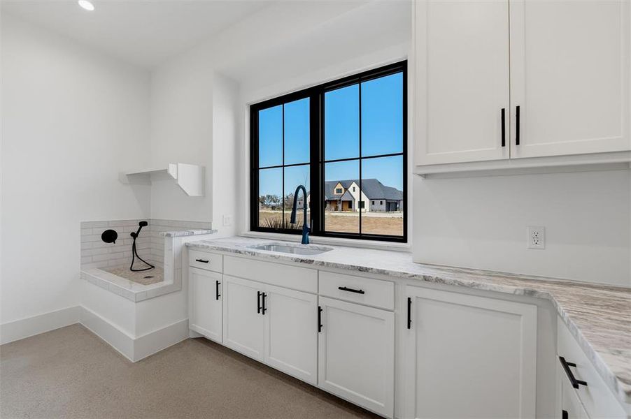 Laundry area with dog wash and sink Laundry area with dog wash and sink