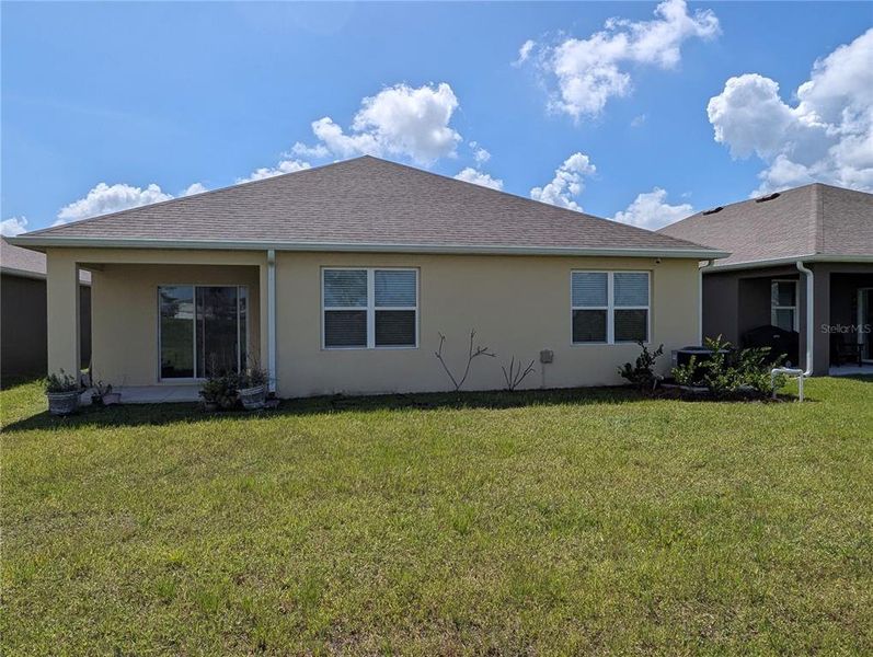 Exterior details and patio area of a home in Cypress Bay West, Palm Bay (Image 15). Exterior details and patio area of a home in Cypress Bay West, Palm Bay (Image 15).