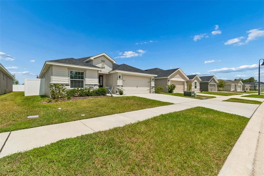 Front exterior of a new home in , Zephyrhills, FL, highlighting curb appeal (Image 30).