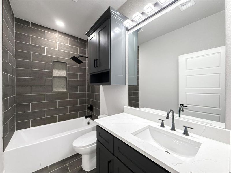 Bathroom with shower / bathtub combination and vanity