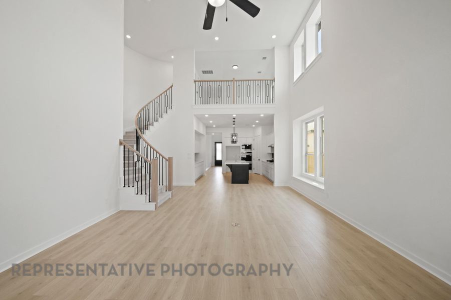 Representative Photo of family room into dining area.