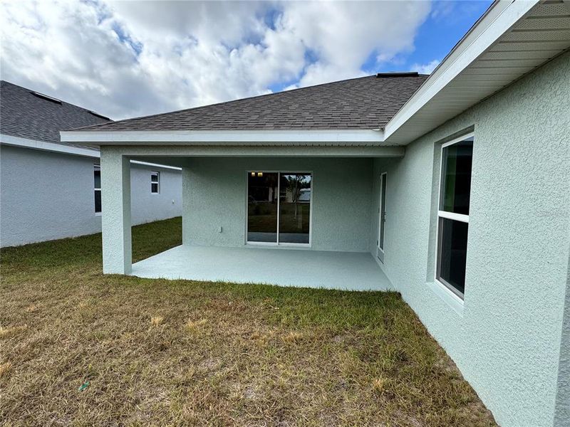 Exterior details and patio area of a home in Watercress Cove, North Port (Image 1).