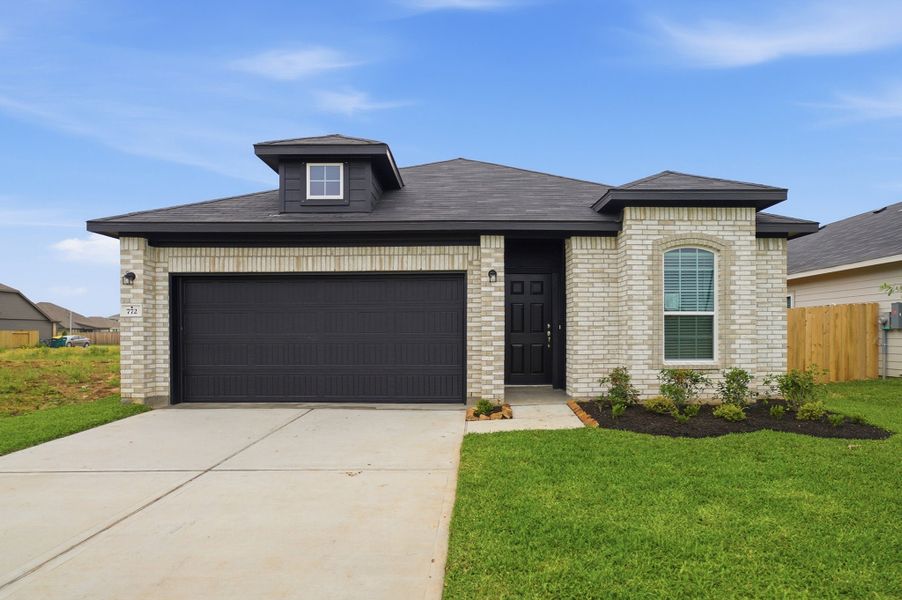 Front exterior of a new home in Trails at Woodhaven Lakes, La Marque, TX, highlighting curb appeal (Image 1). Front exterior of a new home in Trails at Woodhaven Lakes, La Marque, TX, highlighting curb appeal (Image 1).