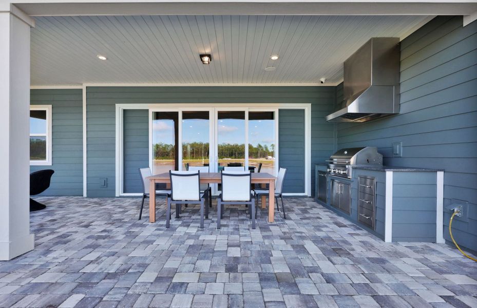 Exterior details and patio area of a home in The Landings at Saint Johns, St. Johns (Image 3).