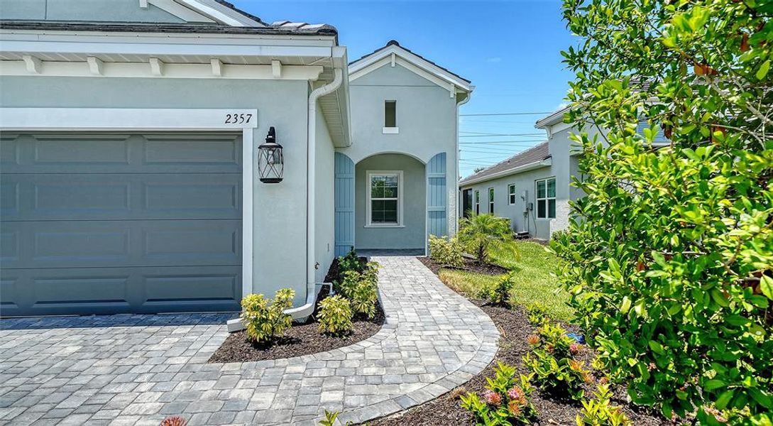 Exterior details and patio area of a home in Windward Real Estate and Homes for Sale in Sarasota, FL - Neal Communities, Lakewood Ranch (Image 23).