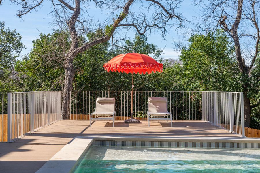 Swimming pool with a patio area