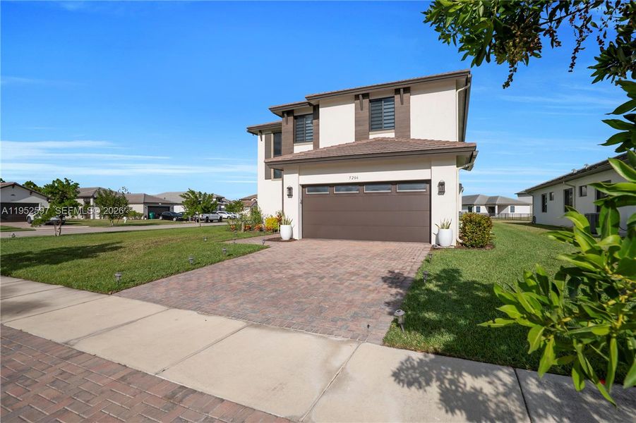 Front exterior of a new home in , Ave Maria, FL, highlighting curb appeal (Image 24). Front exterior of a new home in , Ave Maria, FL, highlighting curb appeal (Image 24).