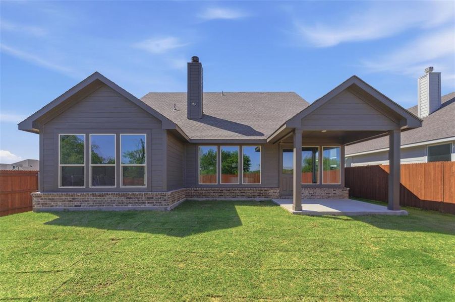Exterior details and patio area of a home in Covenant Park, Springtown (Image 26).