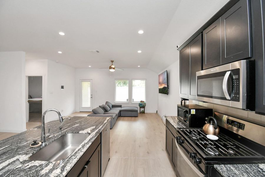 Furnished interior view inside a new home in Post Oak Pointe, Fresno (Image 10).
