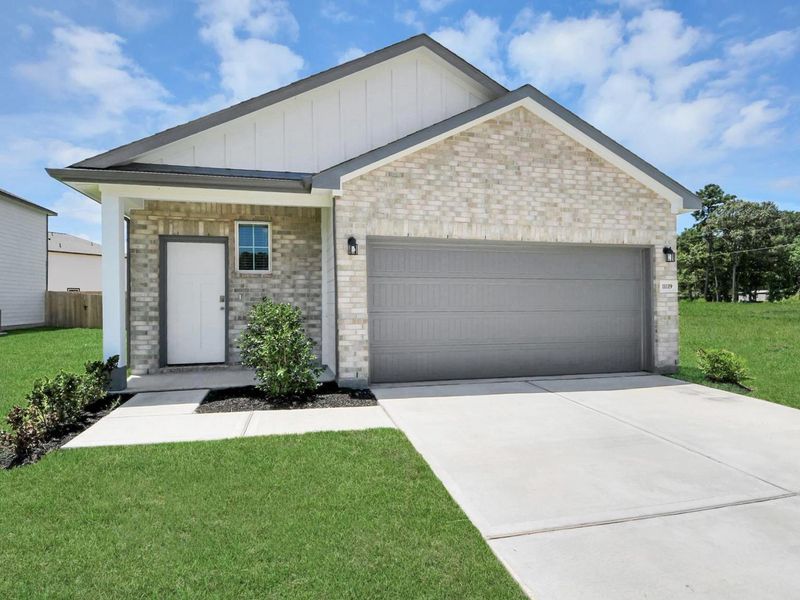 Front exterior of a new home in Liberty Estates, Cleveland, TX, highlighting curb appeal (Image 2). Front exterior of a new home in Liberty Estates, Cleveland, TX, highlighting curb appeal (Image 2).
