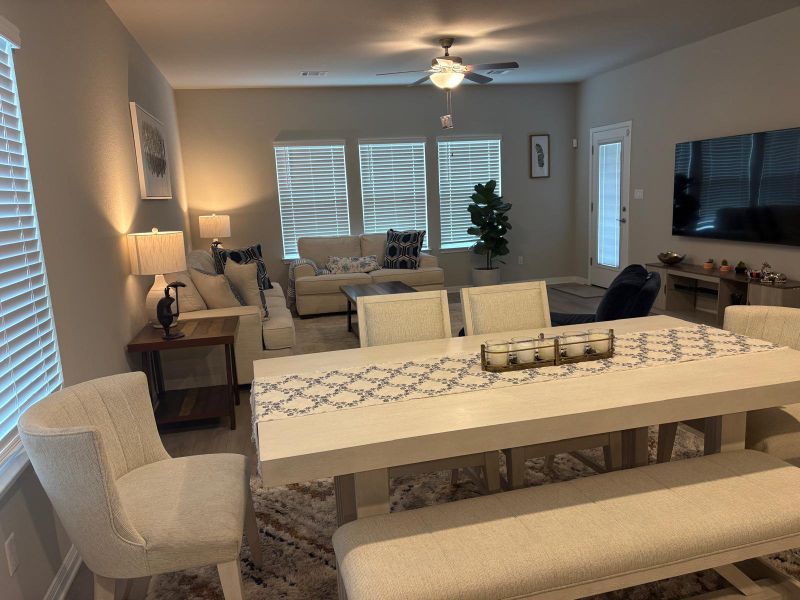 An open concept living and dining area provides an inviting atmosphere for daily living and entertaining.