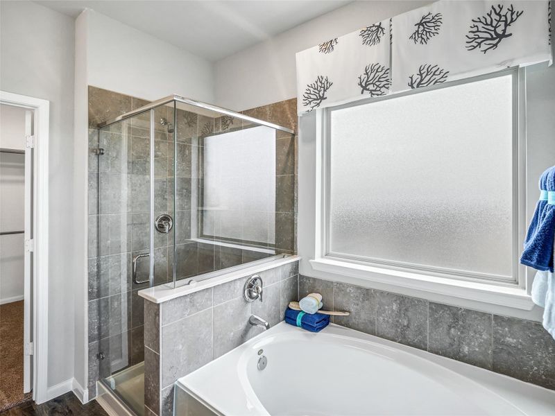 Delight in a spacious walk-in shower enveloped in stylish tile surround, and unwind in a separate garden tub adorned with custom detailing. Delight in a spacious walk-in shower enveloped in stylish tile surround, unwind in a separate garden tub adorned with custom detailing, Delight in a spacious walk-in shower enveloped in stylish tile surround, and unwind in a separate garden tub adorned with custom detailing. Delight in a spacious walk-in shower enveloped in stylish tile surround, unwind in a separate garden tub adorned with custom detailing,