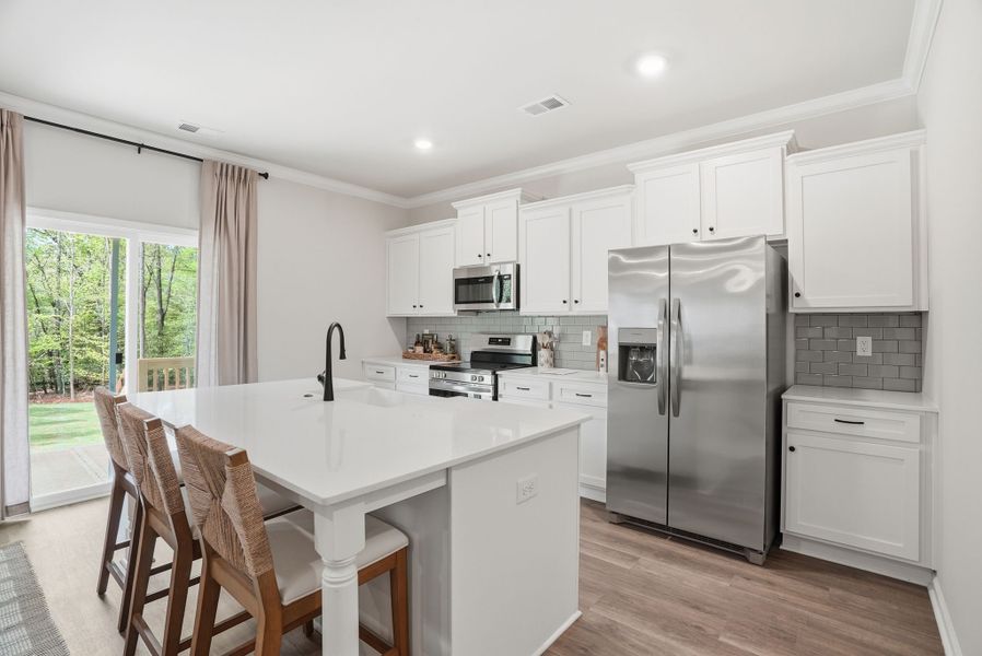 Representative furnished interior of a home built from the Myrtle Select M by McGuinn Homes in Broadway Lake, Anderson (Image 24).