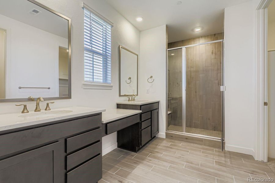 Furnished interior view inside a new home in Sunset Village: The Grand Collection, Erie (Image 6).