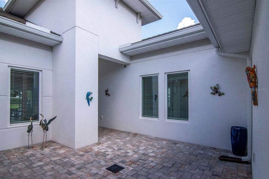 Exterior details and patio area of a home in River's Edge, Wesley Chapel (Image 23).