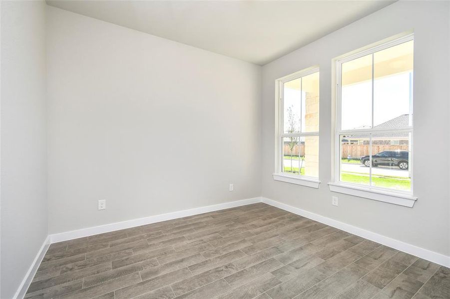 Make memories gathered around the table with your family and friends! This dining spacious room features elegant flooring, custom paint, and adjacent to family room and kitchen for open concept feel.