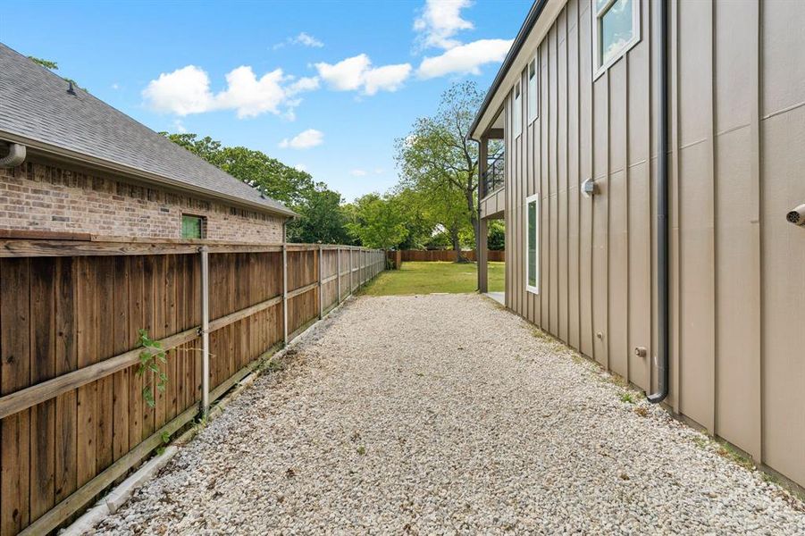 Side yard with rock great for storage area.