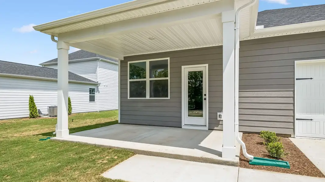 Exterior details and patio area of a home in Reserve at Hickory Ridge, Columbia (Image 25).