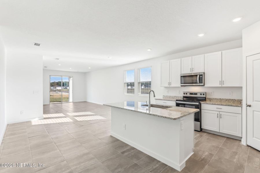 Furnished interior view inside a new home in Lakes at Bella Lago - Signature Series, Green Cove Springs (Image 5). Furnished interior view inside a new home in Lakes at Bella Lago - Signature Series, Green Cove Springs (Image 5).