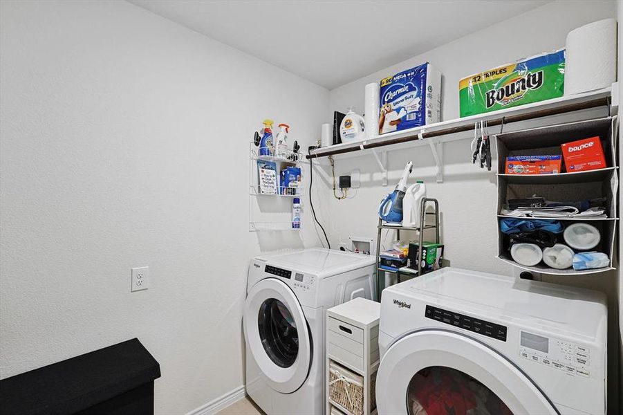 Laundry area featuring separate washer and dryer