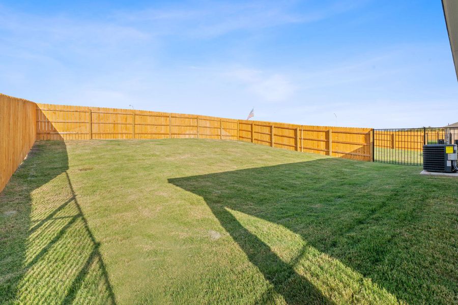View of fenced backyard