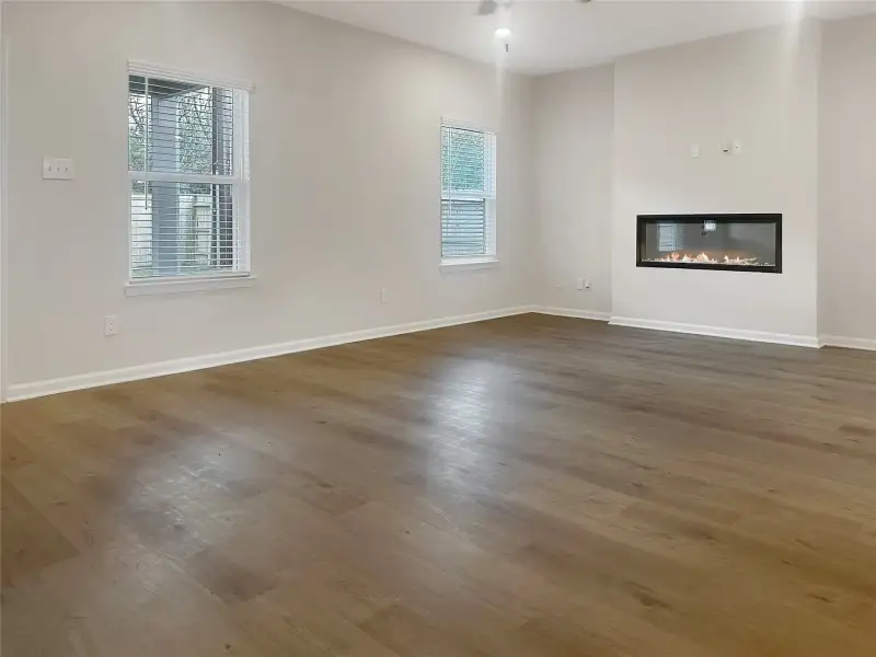 The Crawford- Family Room with Linear Electric Fireplace. Home is under construction, photos used for illustration only; actual features, colors, and upgrades may vary.