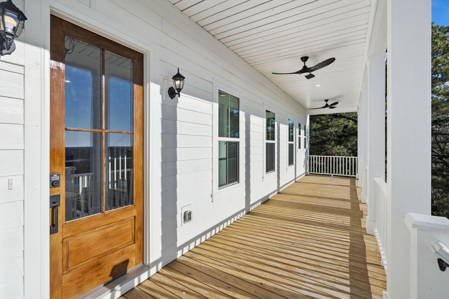 Exterior details and patio area of a home in Overlook at Copahee Sound, Awendaw (Image 40).