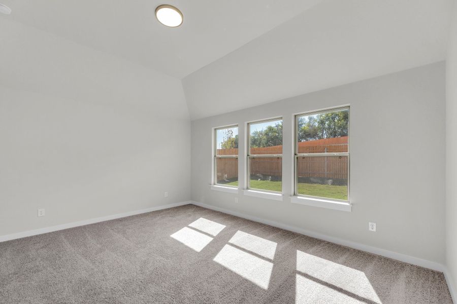 Primary Suite in the Evelyn Pecos model home in Austin TX by Trophy Signature Homes